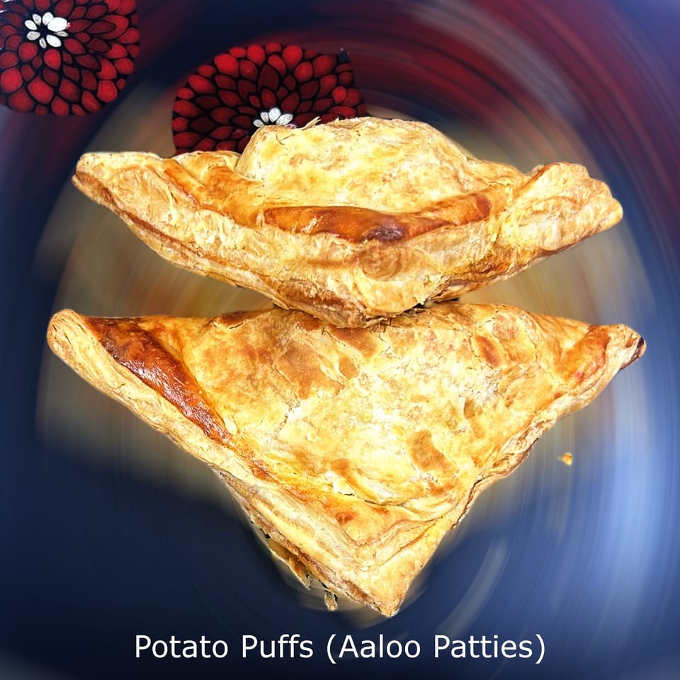 Golden-brown potato puffs, or aaloo patties, stacked on a decorative plate.