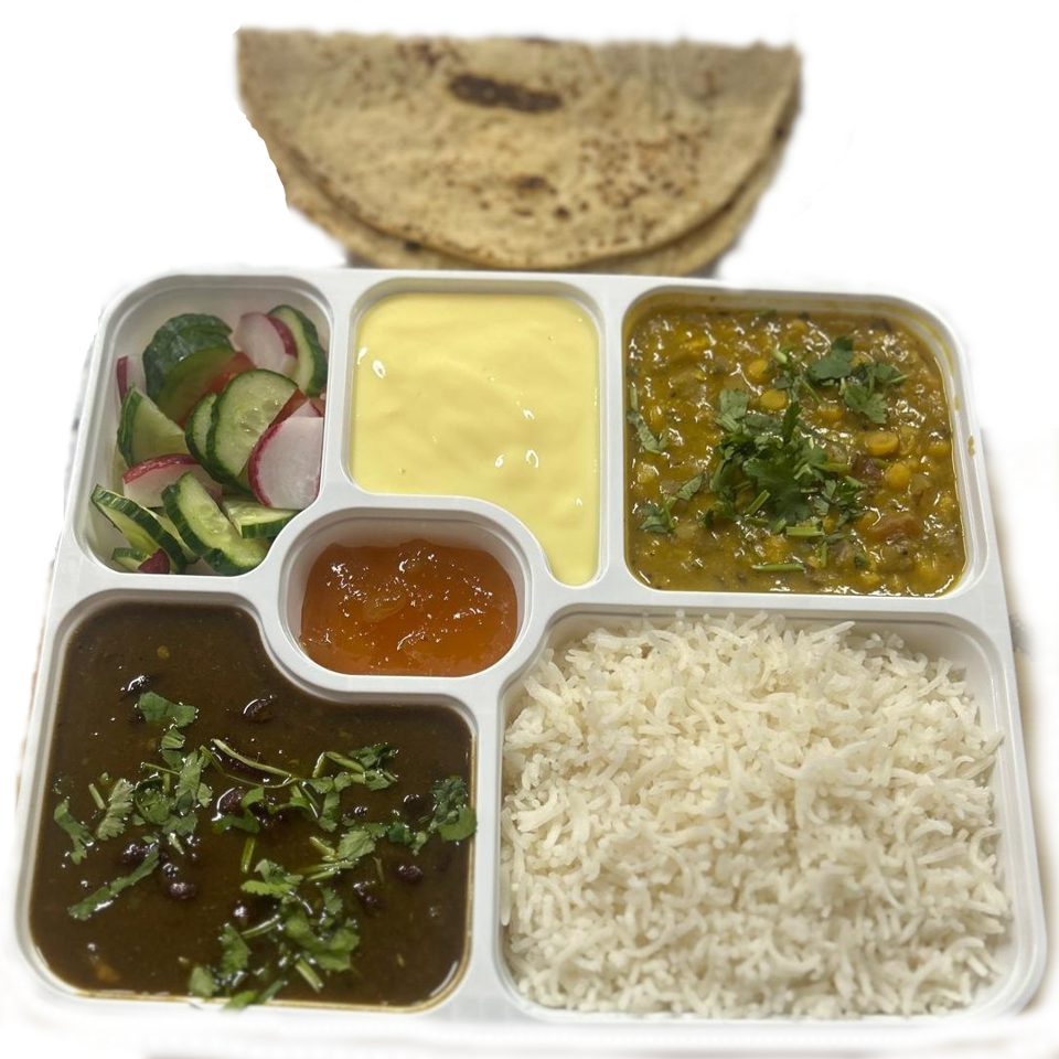 Indian meal platter with naan, basmati rice, lentil curry, vegetable curry, salad, creamy sauce, and chutney.